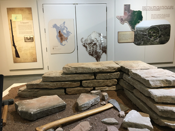 Visitors viewing the Living in a Dugout exhibition